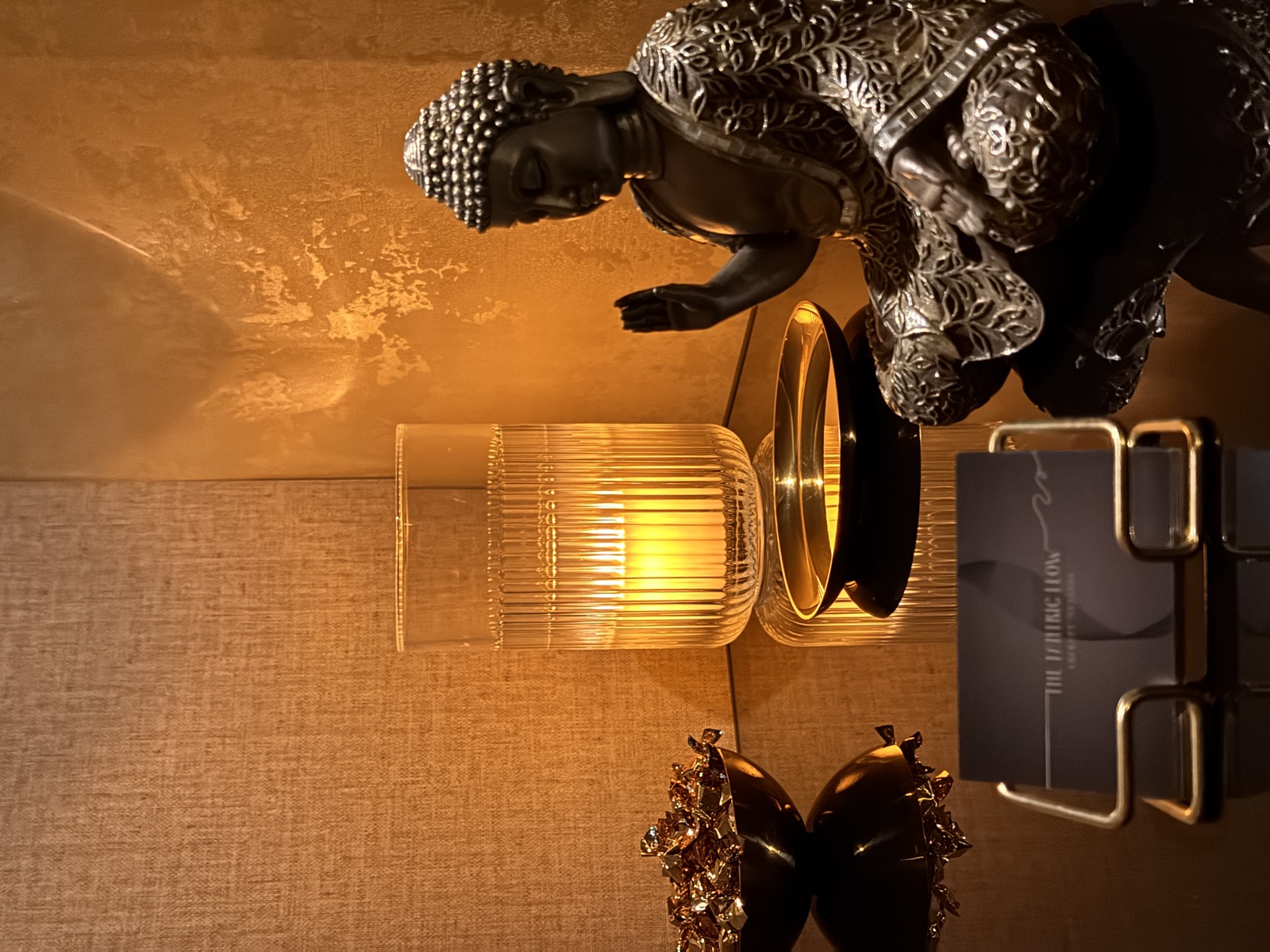 Zen décor with Buddha, candle and The Tantric Flow cards in Lisbon